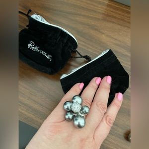 Designer’s jewelry earrings and a ring. Silver with grey pearls